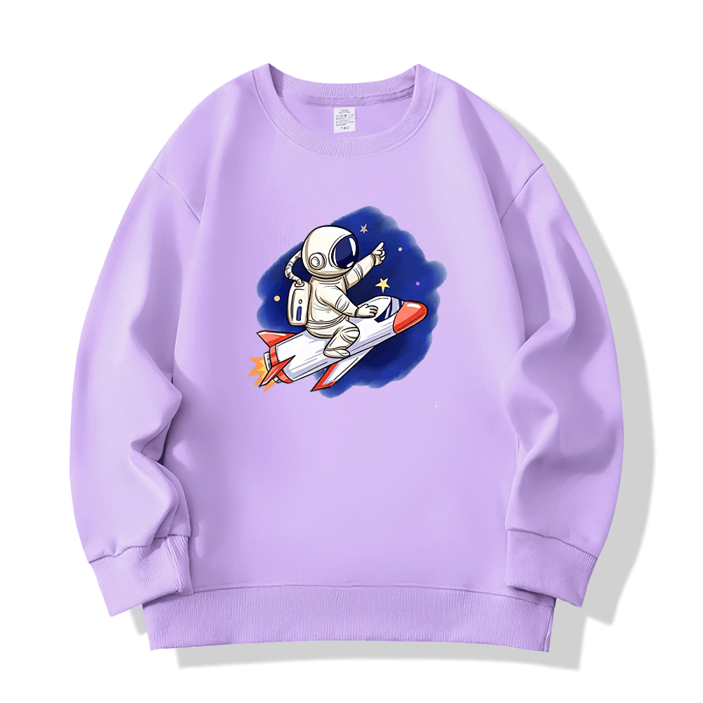 Kids Astronaut Rocket Ride Sweatshirt in purple, featuring a whimsical space theme with an astronaut on a rocket surrounded by stars.